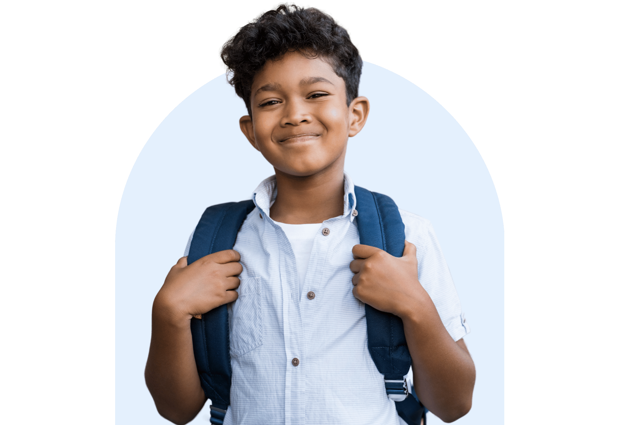 Smiling primary school student wearing a backpack, standing confidently against a light blue background.
