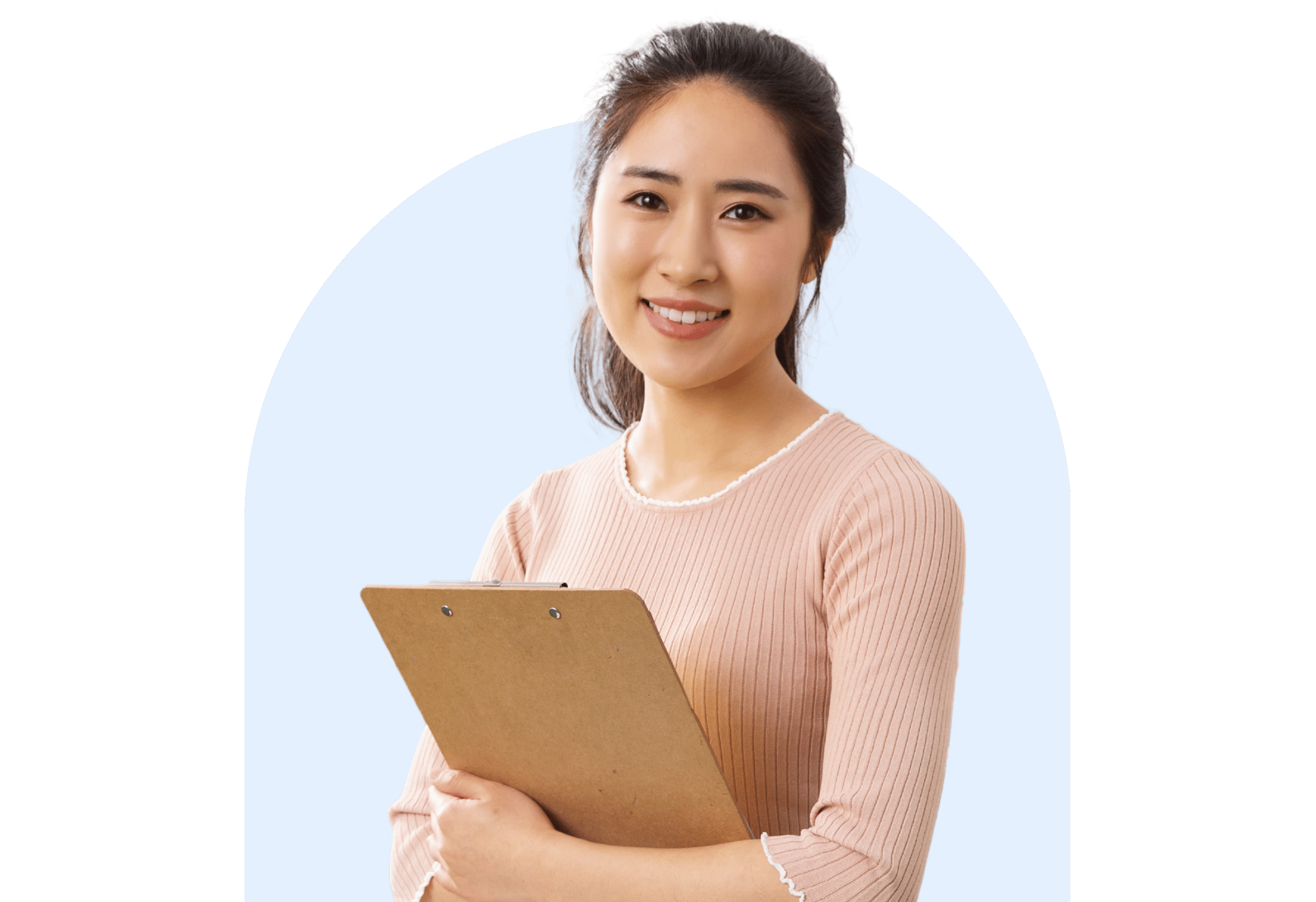Smiling female teacher holding a clipboard, posed in front of a light blue background.
