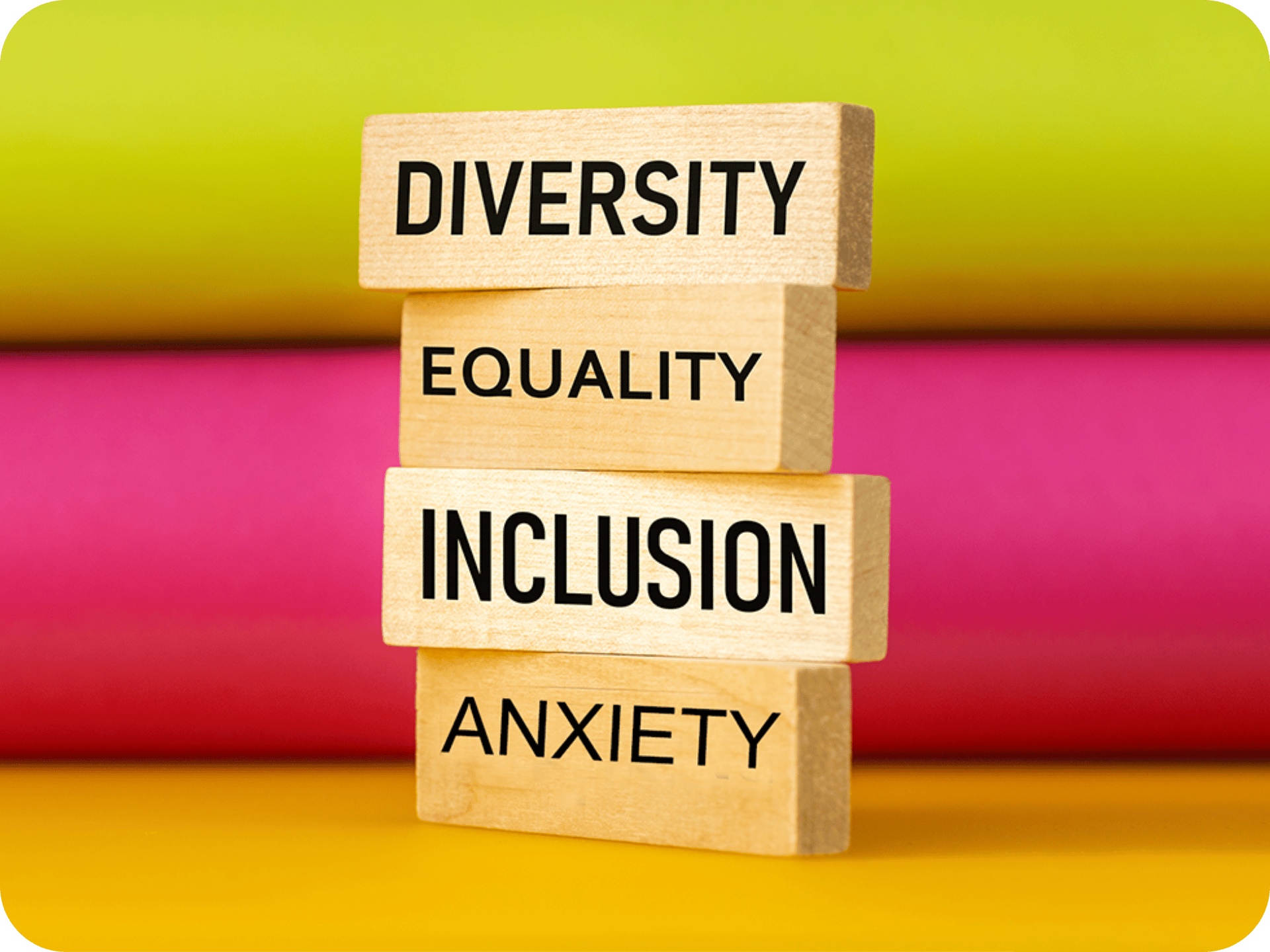 Stacked wooden blocks with words Diversity, Equality, Inclusion, and Anxiety against a colorful background
