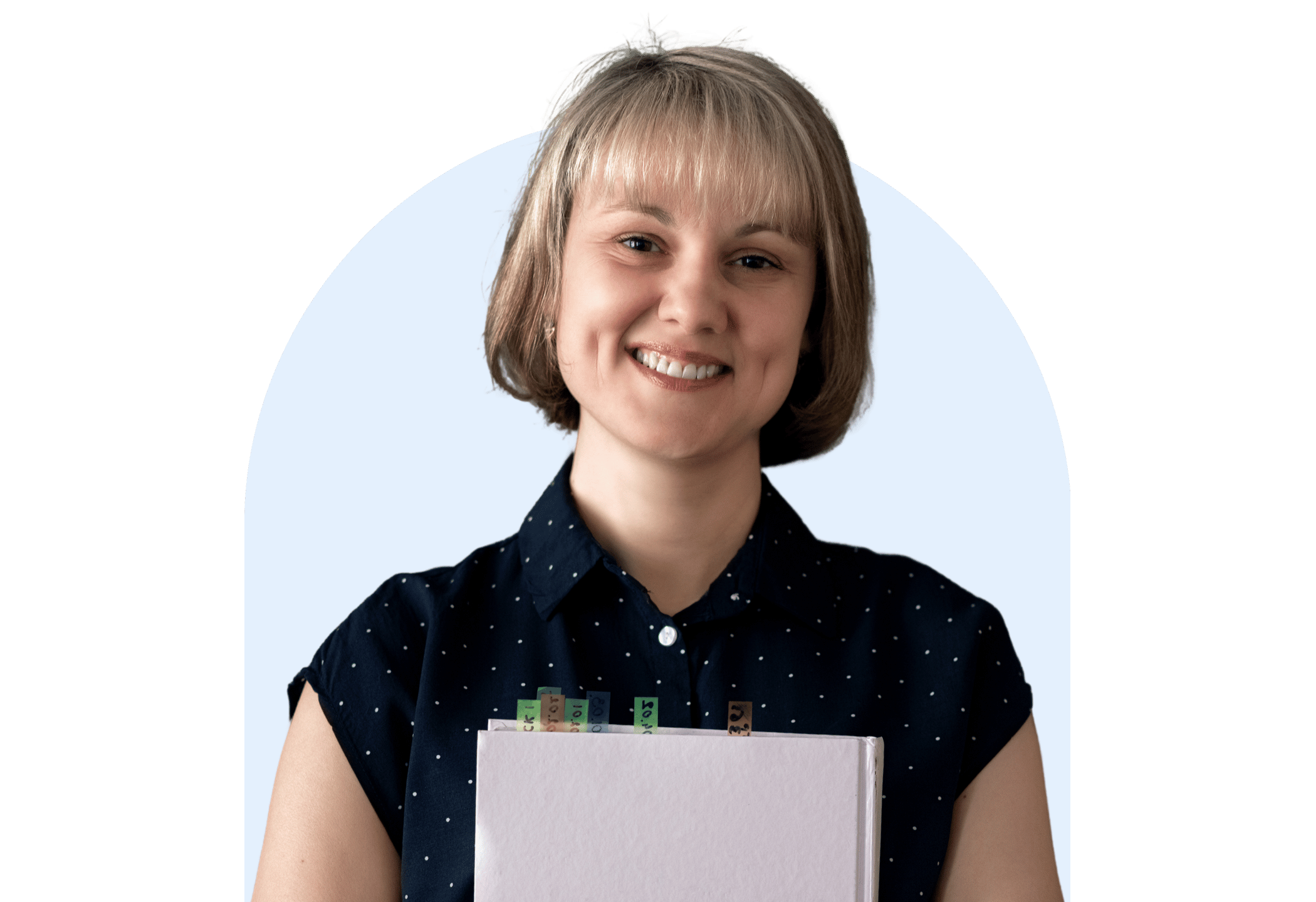 Smiling primary school teacher holding a folder with labelled tabs, standing in front of a light blue background