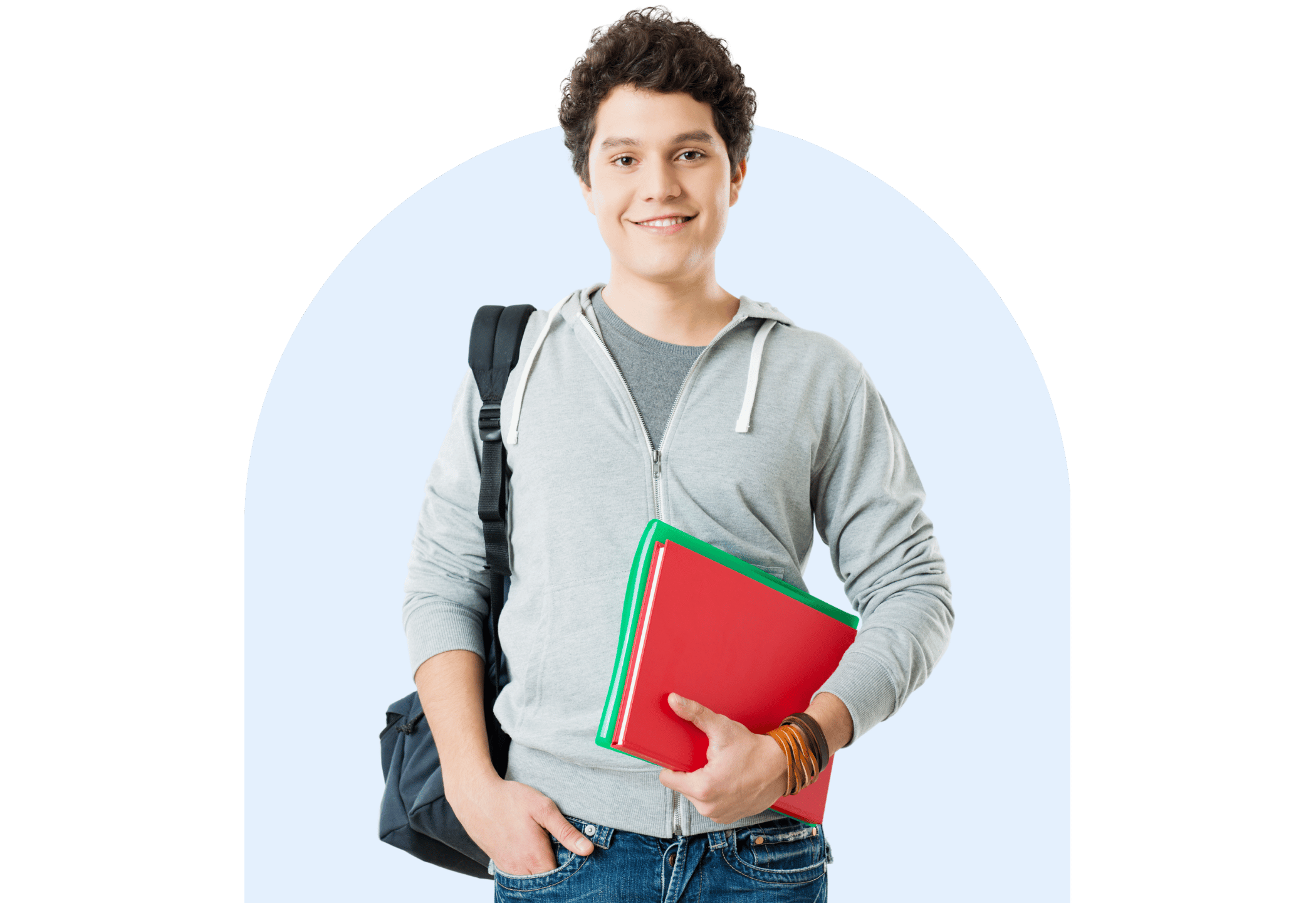Smiling secondary school student wearing a hoodie and backpack, holding bright red folders, standing confidently in front of a light blue background.